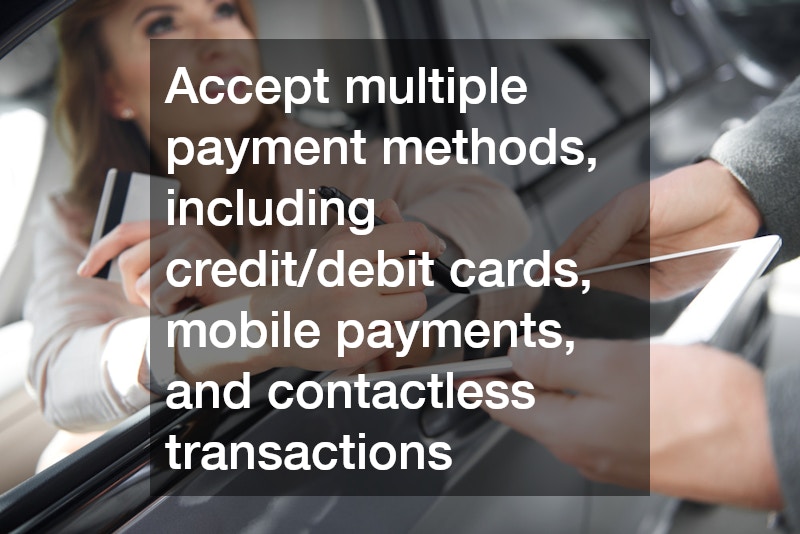 woman in a car holding a credit card and signing on a tablet to complete a transaction